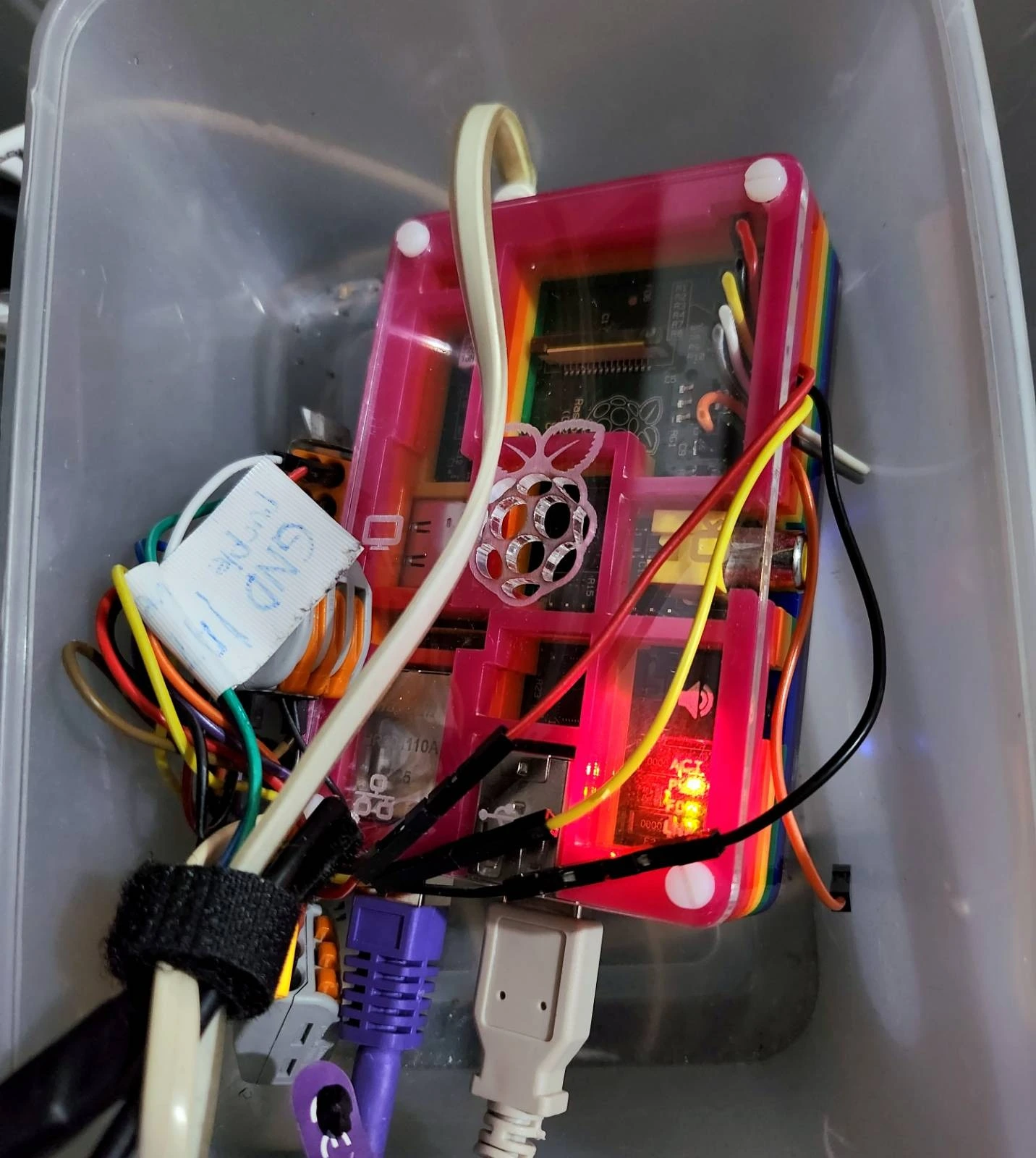 I have a small repurposed plastic box to contain the Raspi and its wiring